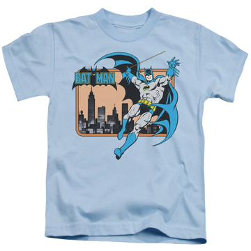 Light blue kid's t-shirt for ages 4 to 7 with DC Batman Batman In The City graphic